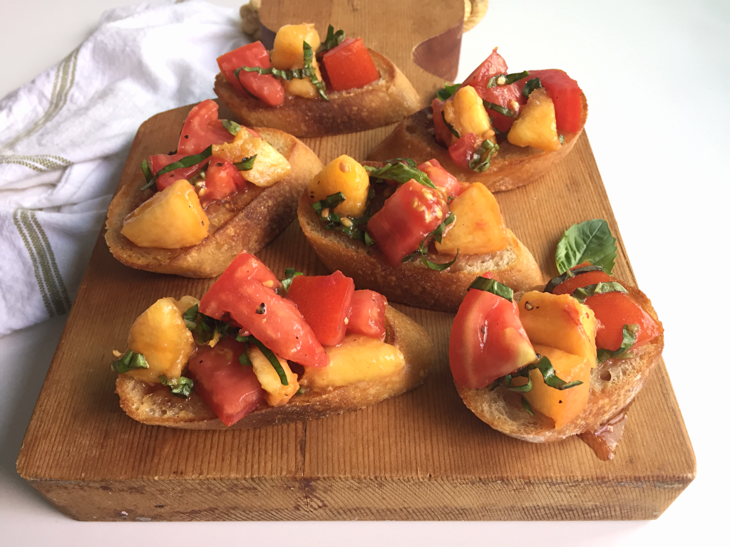 AMAZING Tomato Peach Bruschetta! Bursting with fresh tomatoes and perfectly ripe peaches - SO flavorful and I bet you can't just eat one! #dairyfree #vegan #recipe | Peach and the Cobbler