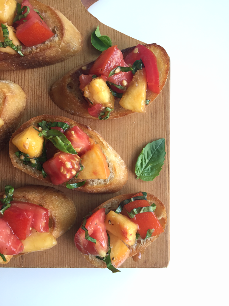 AMAZING Tomato Peach Bruschetta! Bursting with fresh tomatoes and perfectly ripe peaches - SO flavorful and I bet you can't just eat one! #dairyfree #vegan #recipe | Peach and the Cobbler
