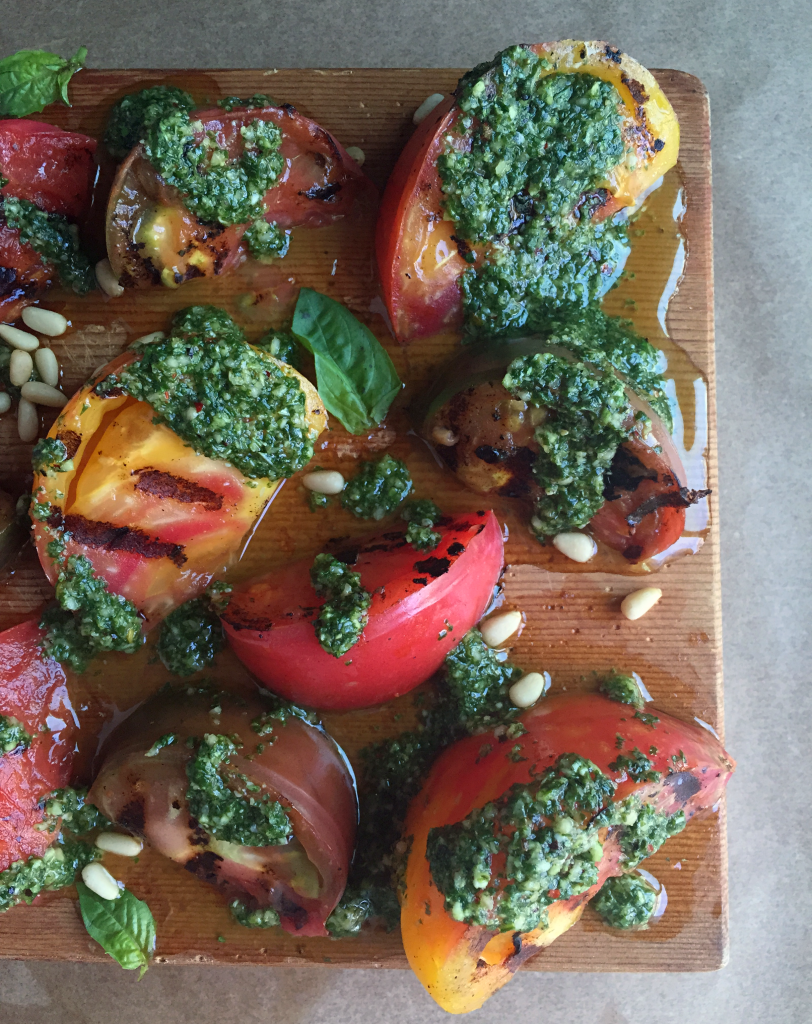 AMAZING Grilled Pesto Tomatoes! The perfect side for any summer get together! Sweet grilled tomatoes + super flavorful (dairy free) basil pesto! YUM! #dairyfree #vegan #recipe | Peach and the Cobbler