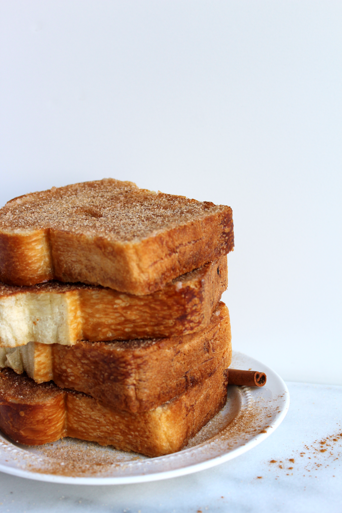 BEYOND EASY 5 Minute Cinnamon Sugar Toast! This is the toast of your childhood! Pan toasted/fried bread topped w/ a hefty dose of cinnamon sugar! YES!  #vegan #recipe | peachandthecobbler.com