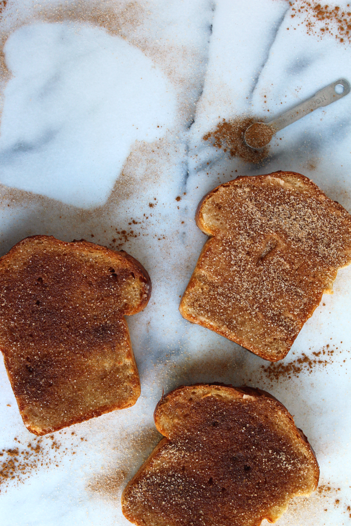 BEYOND EASY 5 Minute Cinnamon Sugar Toast! This is the toast of your childhood! Pan toasted/fried bread topped w/ a hefty dose of cinnamon sugar! YES!  #vegan #recipe | peachandthecobbler.com