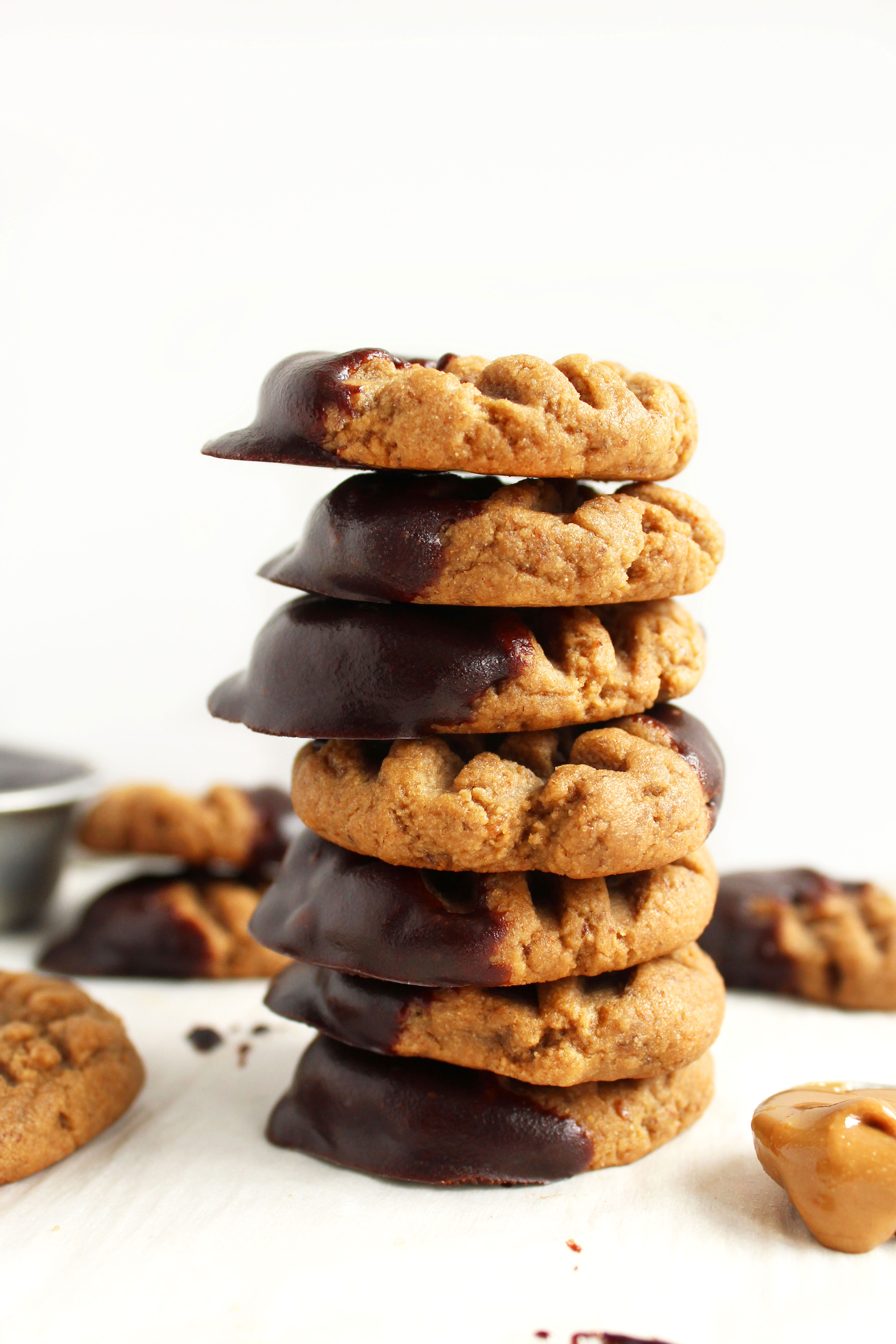 Chewy Chocolate Dipped Sunbutter Cookies (V + GF)! SUPER chewy, peanut-buttery, and delicious! Will cure any peanut butter/chocolate craving! #vegan #glutenfree #cookies | Peachandthecobbler.com