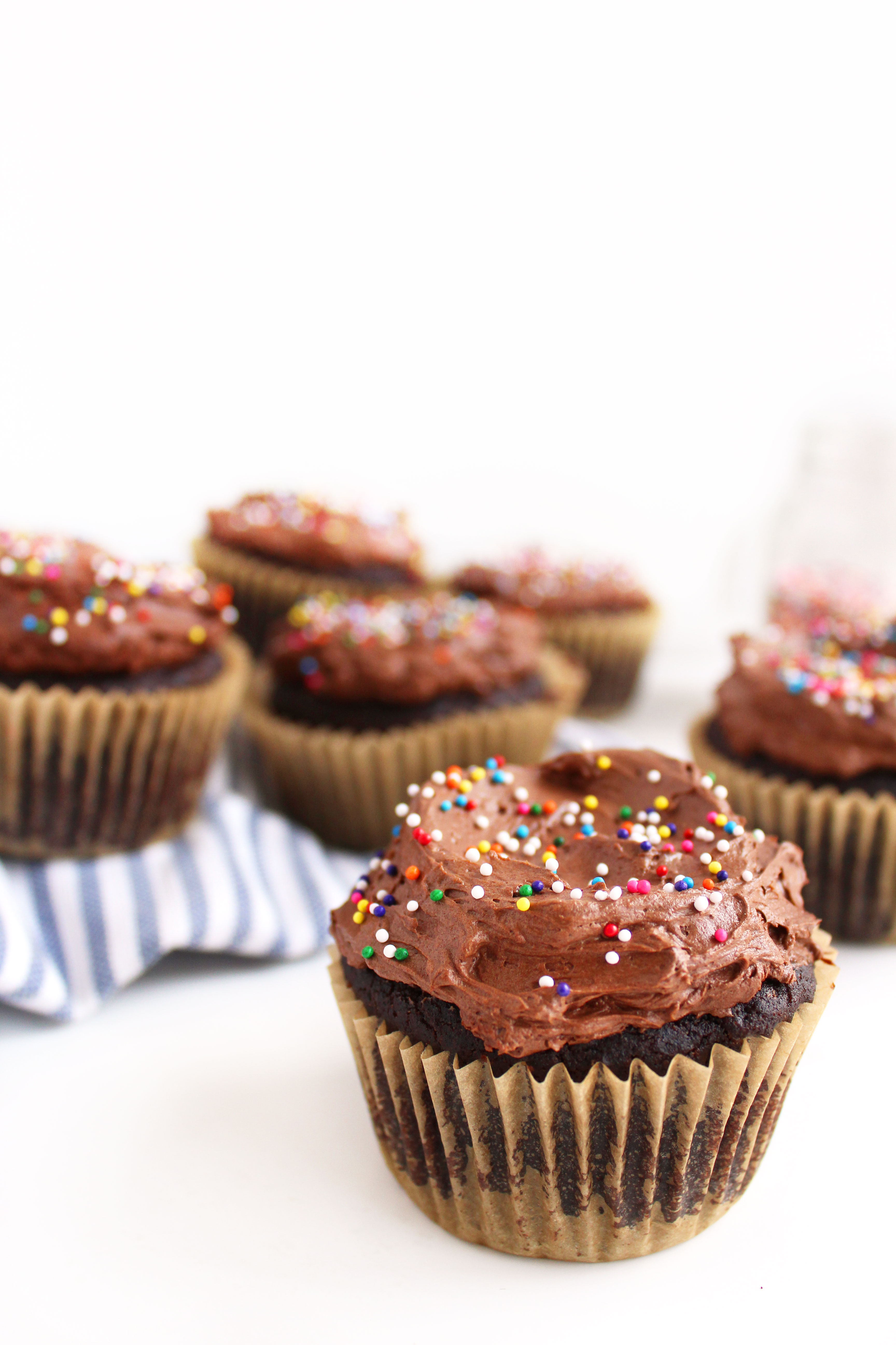Vegan Chocolate Cupcakes (GF)! A cupcake worthy of a celebration - super chocolatey, moist, & topped with a to-die-for fudge frosting! #vegan #glutenfree #cupcakes | Peachandthecobbler.com