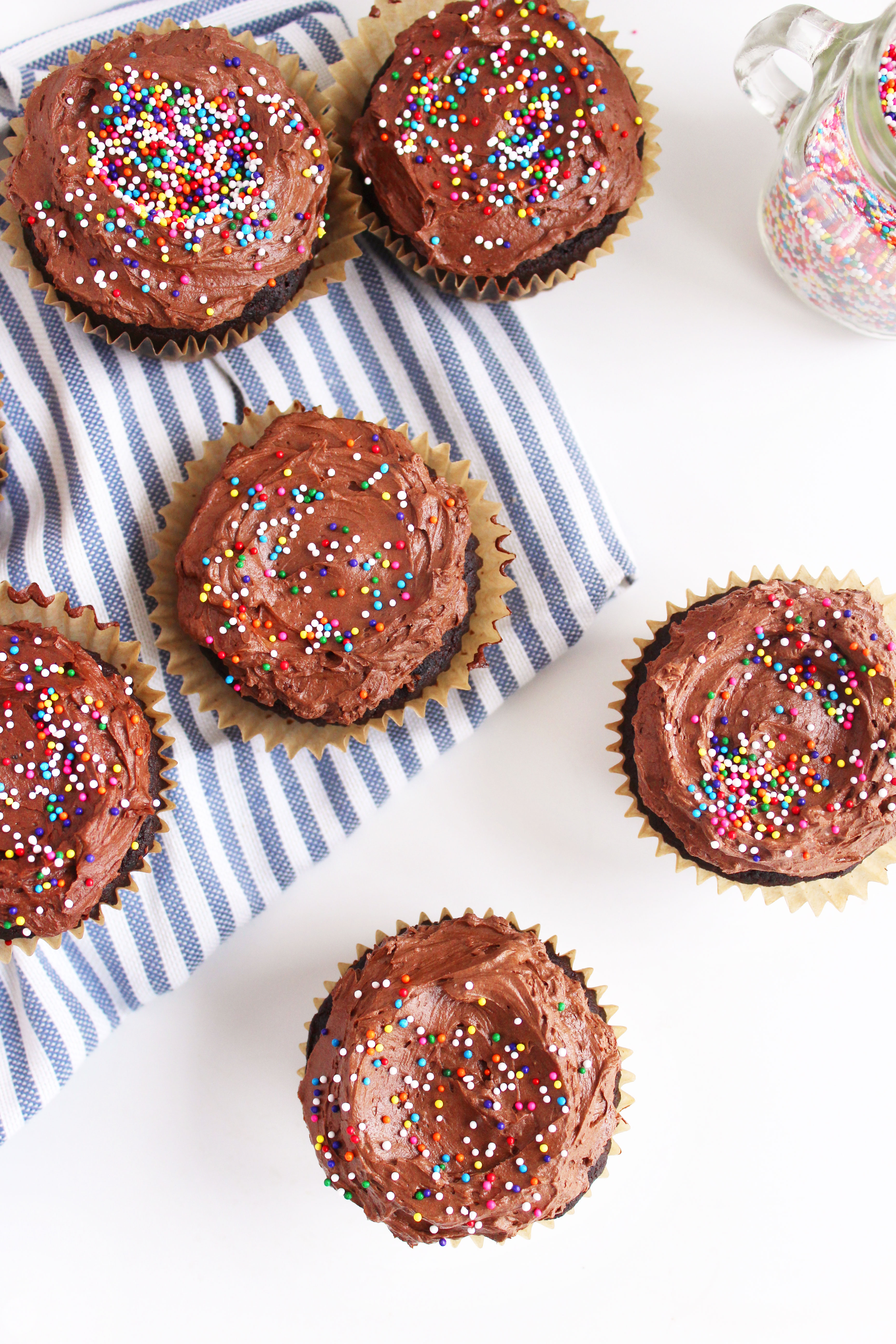 Vegan Chocolate Cupcakes (GF)! A cupcake worthy of a celebration - super chocolatey, moist, & topped with a to-die-for fudge frosting! #vegan #glutenfree #cupcakes | Peachandthecobbler.com